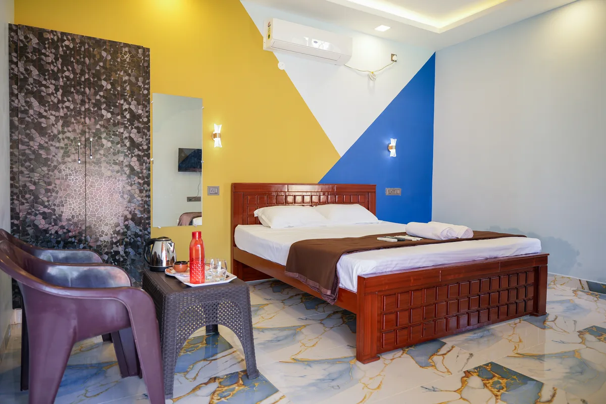 La Mithila Resort Pondicherry - Deluxe Couple Room, bed and room interior view