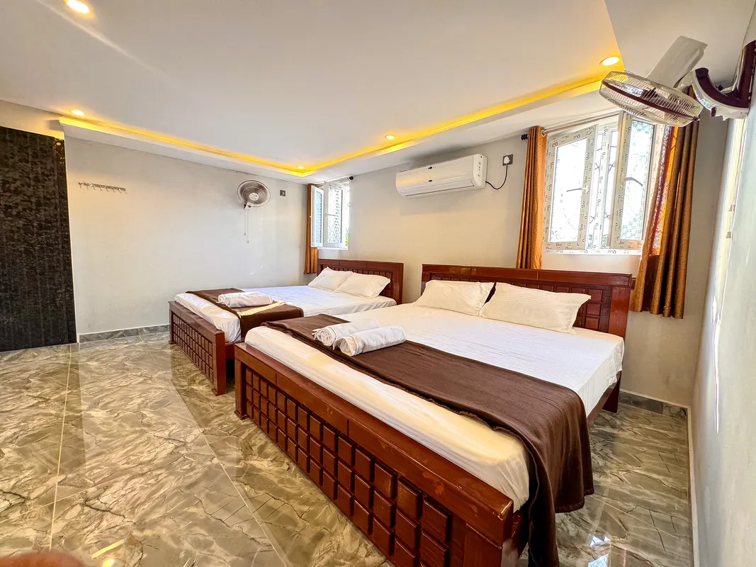 La Mithila Resort Pondicherry - Deluxe Suite Room, dining table and sofa